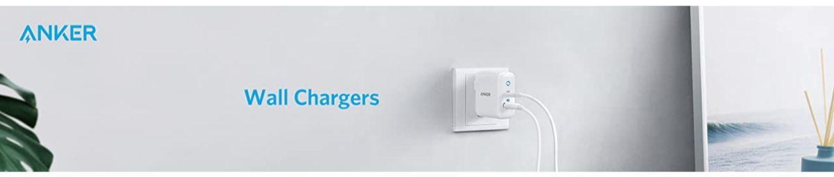 Anker wall charger plugged into outlet with cable, minimalist setup for fast charging