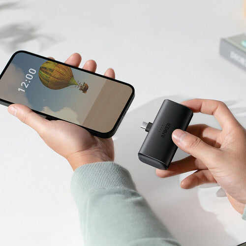 Anker fast charger for smartphone, compact USB-C power adapter in hand, Anker Kuwait