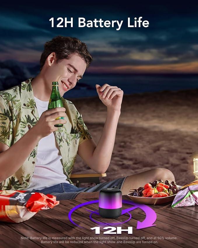 Man enjoying beach picnic with Anker speaker, 12H battery life, snacks, and drinks — Anker Kuwait