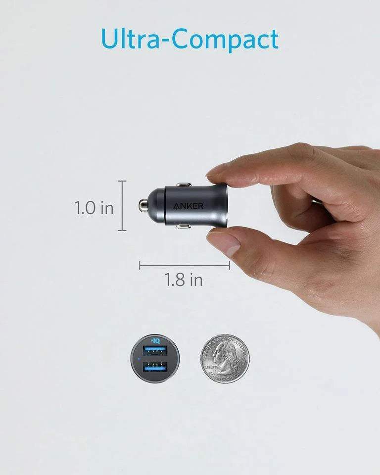 Ultra-Compact Anker car charger, 1.0 x 1.8 inches, held in hand with coin for scale — Anker Kuwait
