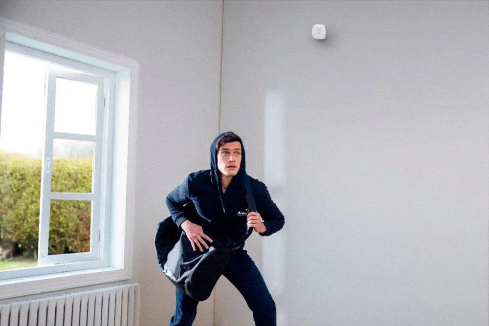 Man in Anker hoodie carrying bag, ready to go — Anker Kuwait