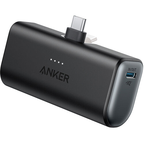 Anker power bank with USB-C cable and IQ charger port, sleek black design for fast charging on the go