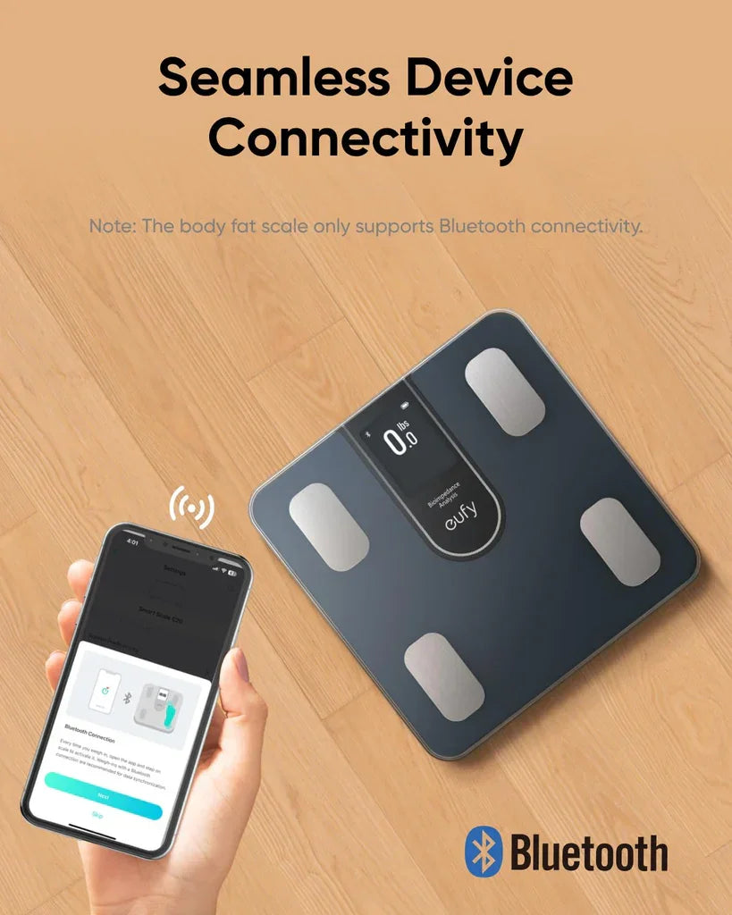 Eufy smart scale with Bluetooth connectivity, shown with phone app on wooden floor — Anker Kuwait
