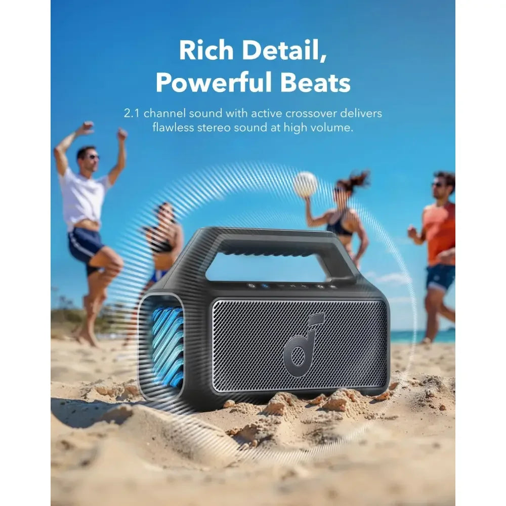 Portable Bluetooth speaker with powerful 2.1 channel sound on beach, Anker Kuwait