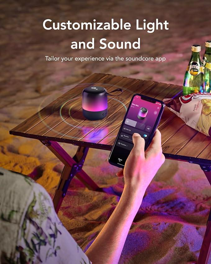 Customizable light and sound Bluetooth speaker with app control on beach table, Anker Kuwait