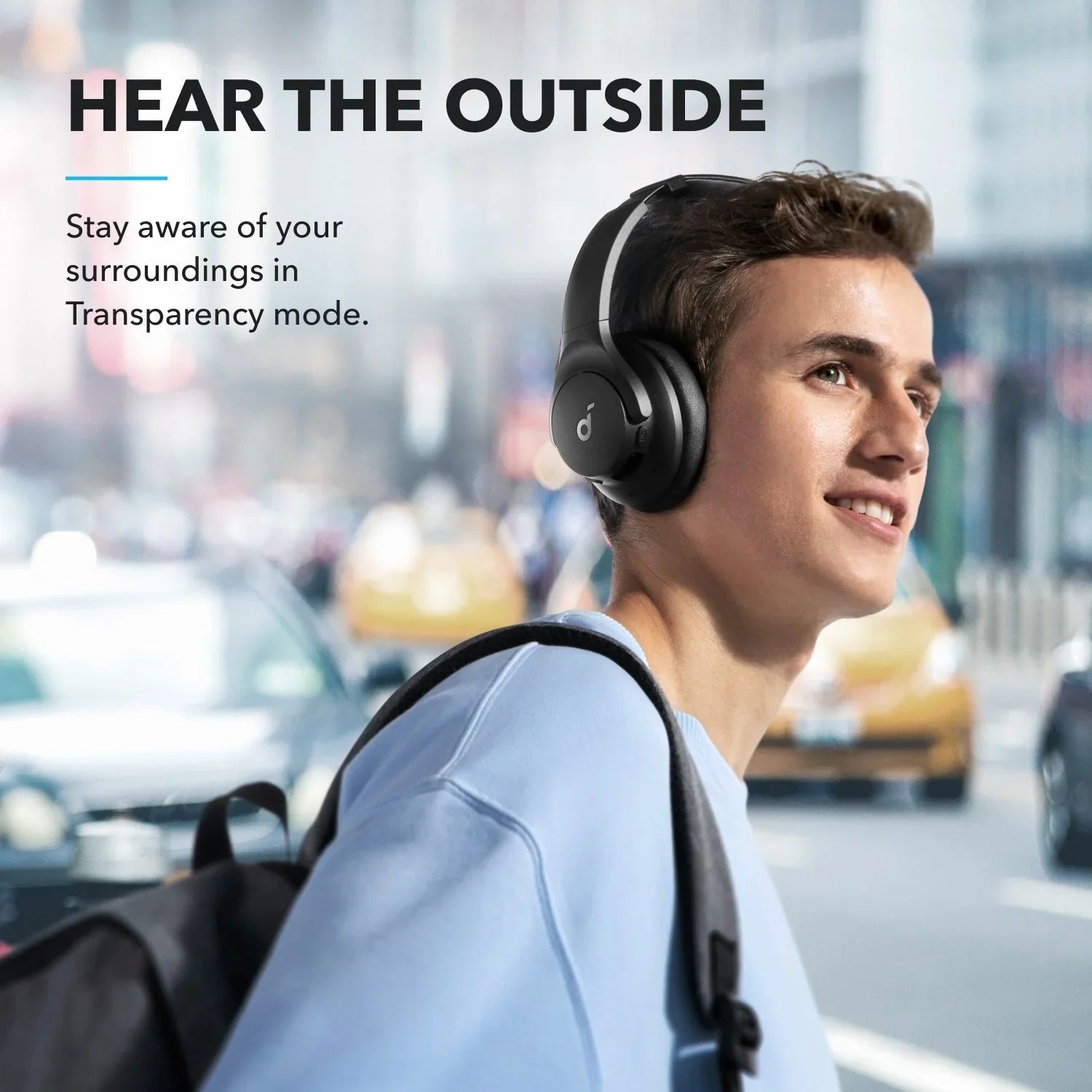 Man wearing wireless headphones with transparency mode in city, Anker Kuwait