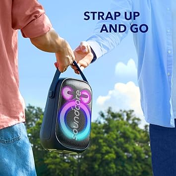 Portable Soundcore speaker with strap, held outdoors — Anker Kuwait